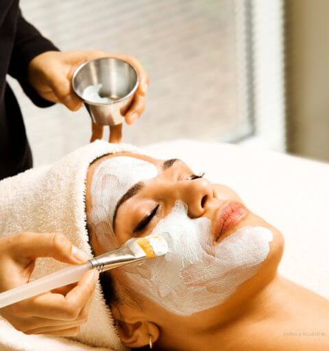 Woman receiving a professional facial treatment at Minh Lashes Beauty Clinic for glowing and healthy skin.